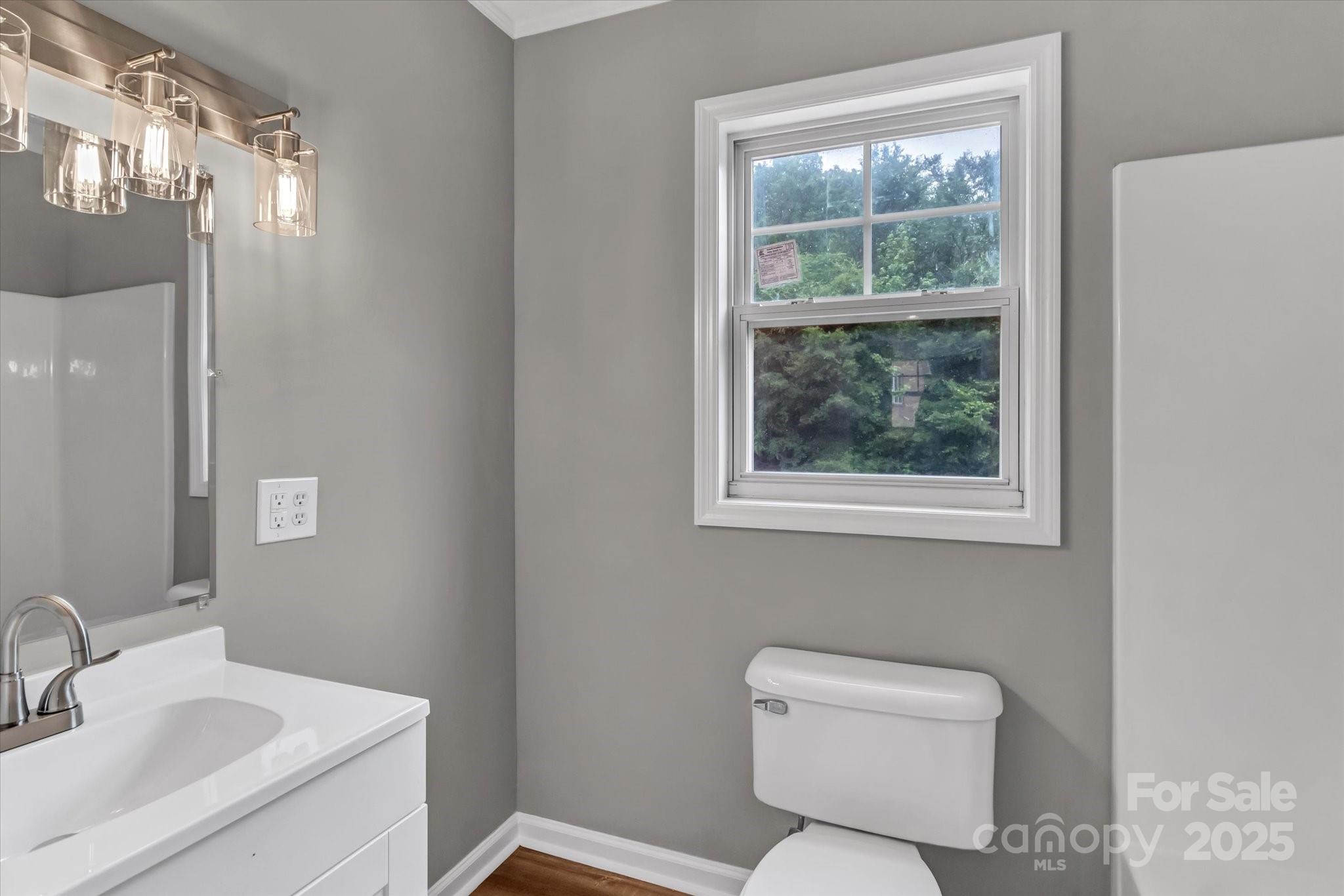 332 East Rebound Road Lancaster, SC 29720 - Photo 25 of 29 a bathroom with a toilet sink and mirror