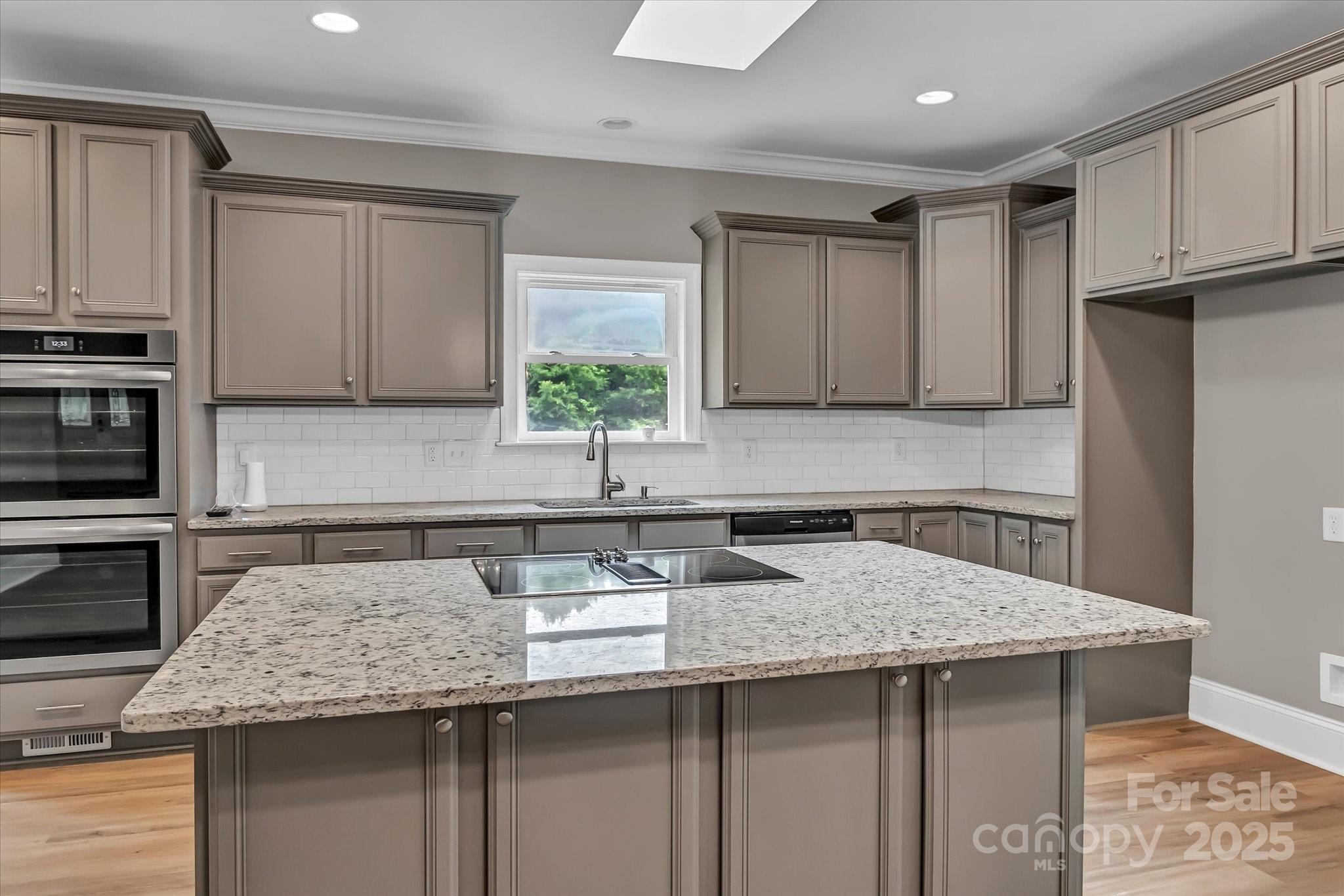 332 East Rebound Road Lancaster, SC 29720 - Photo 5 of 29 a kitchen with granite countertop a sink and a stove