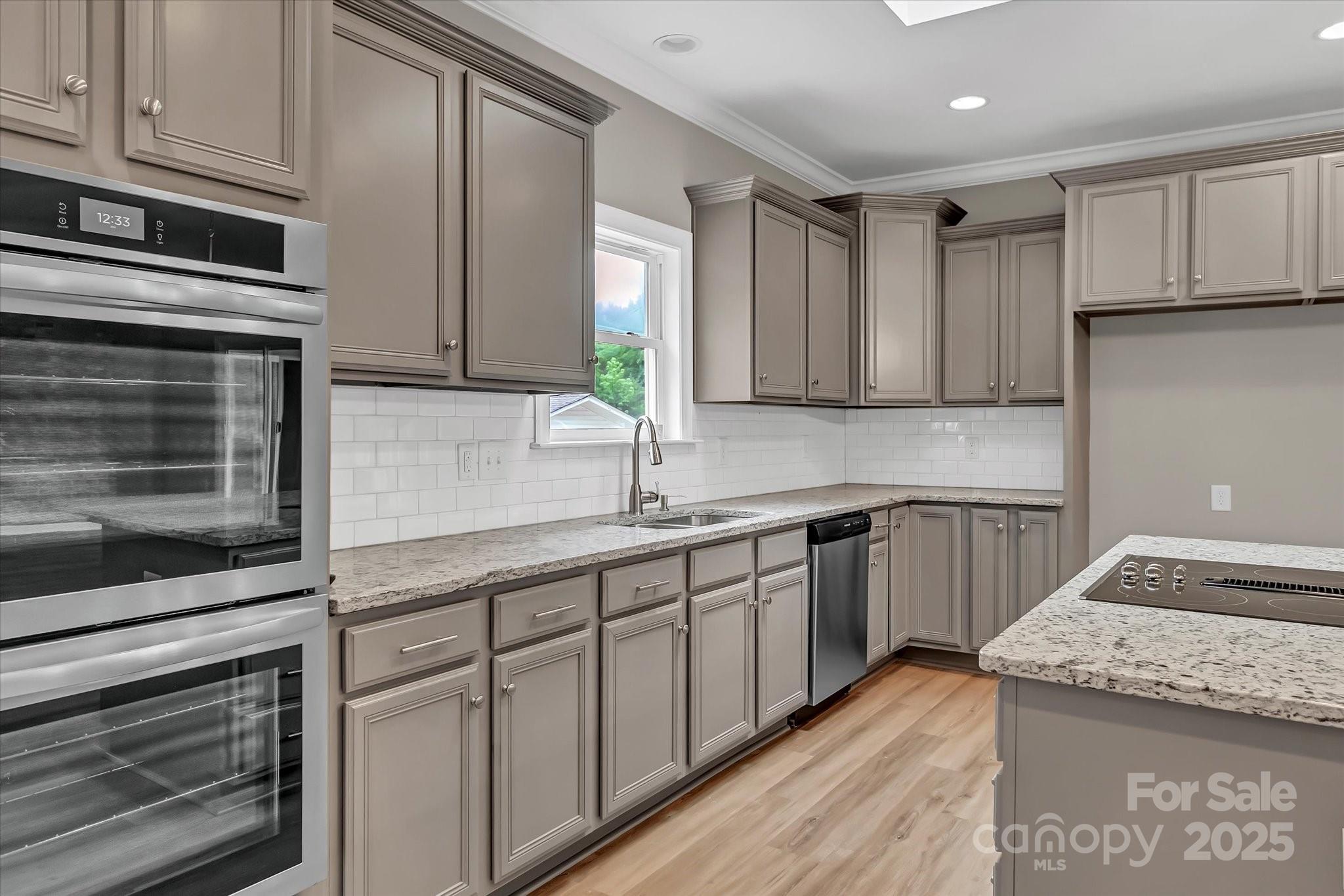 332 East Rebound Road Lancaster, SC 29720 - Photo 6 of 29 a kitchen with granite countertop cabinets stainless steel appliances and a counter space