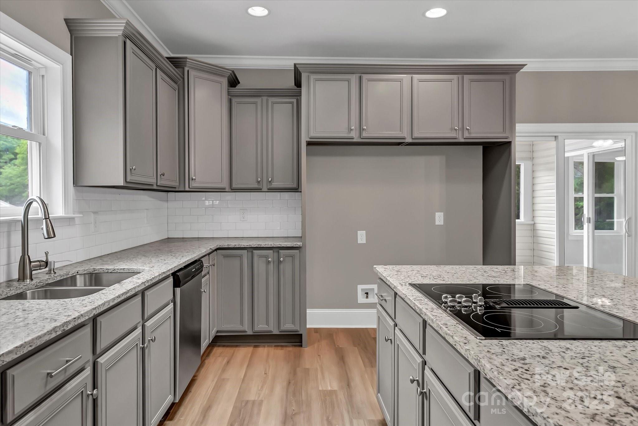 332 East Rebound Road Lancaster, SC 29720 - Photo 7 of 29 a kitchen with a sink stove and cabinets