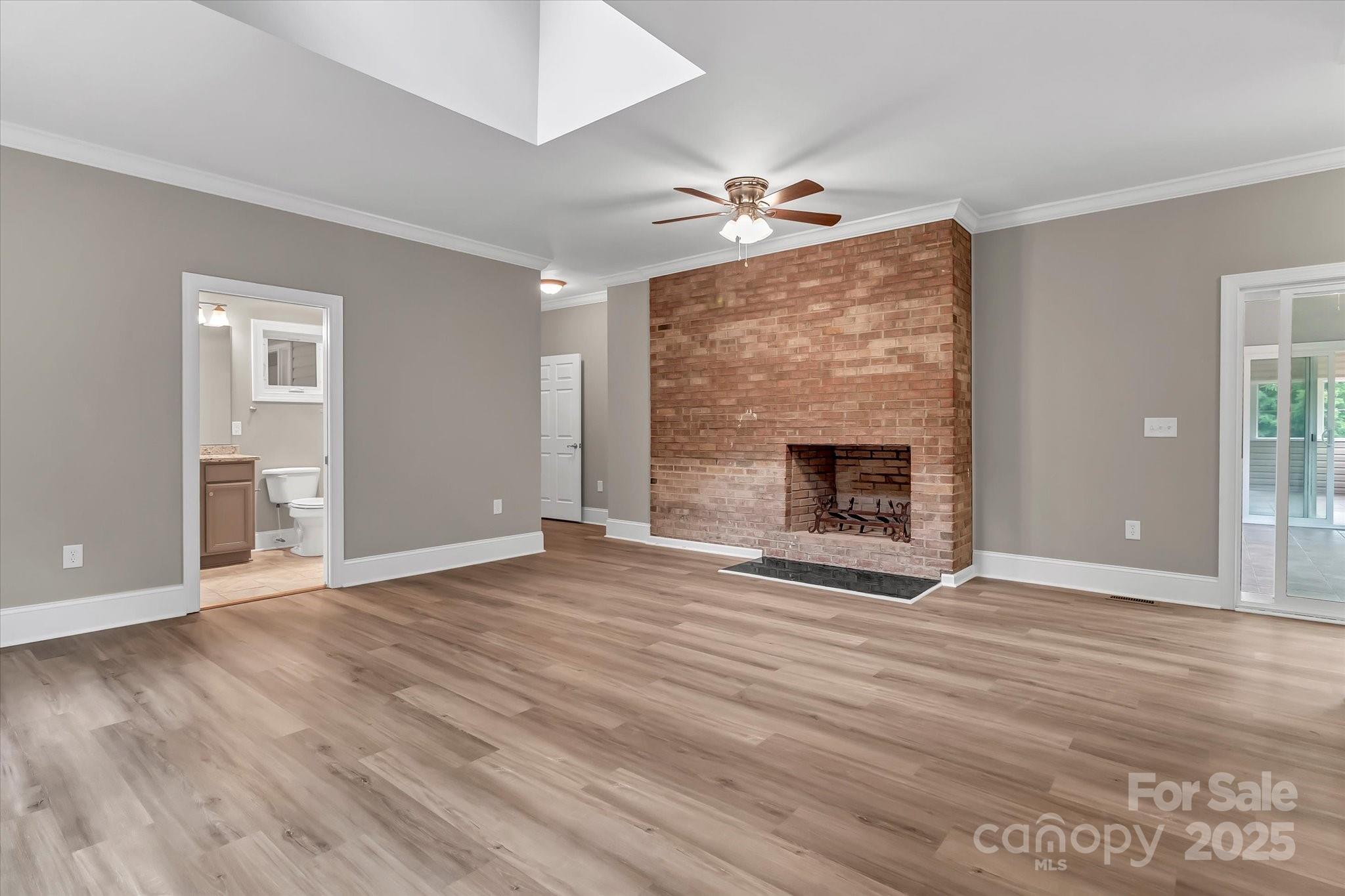332 East Rebound Road Lancaster, SC 29720 - Photo 8 of 29 a view of empty room with wooden floor and fireplace