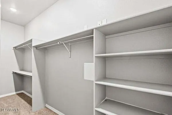 a view of an empty walk in closet