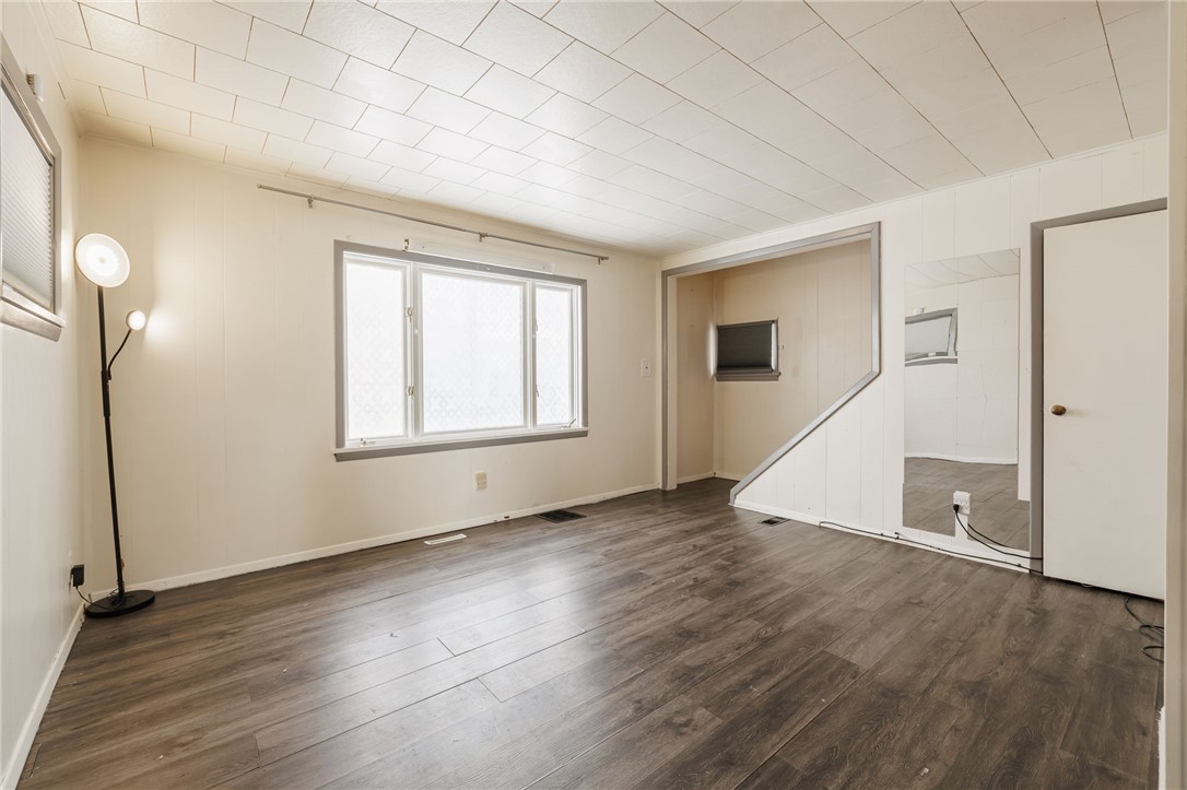 55 Miller Street Seneca Falls, NY 13148 - Photo 5 of 16 Light filled living room w/newer vinyl floorin
