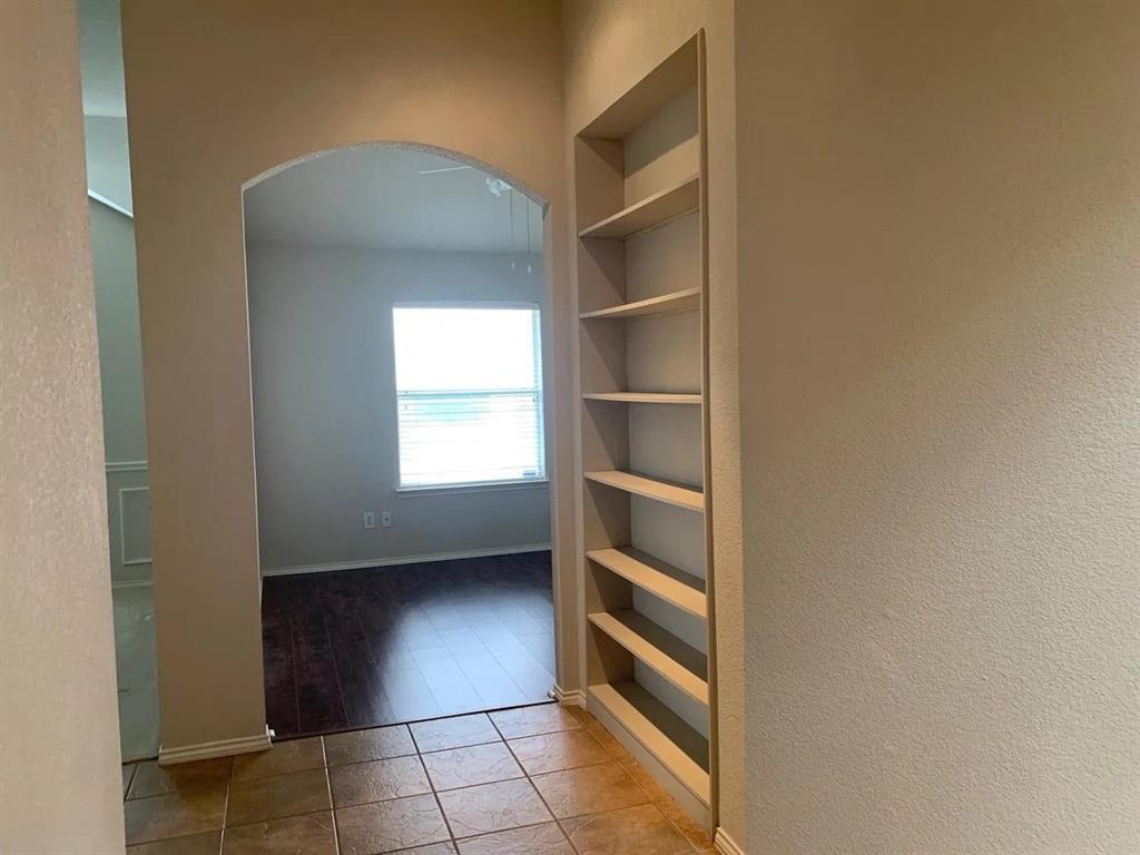7908 Thorneywood Road Plano, TX 75024 - Photo 5 of 5 a view of walk in closet with empty racks