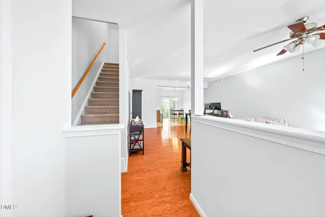a view of kitchen and hall with wooden floor