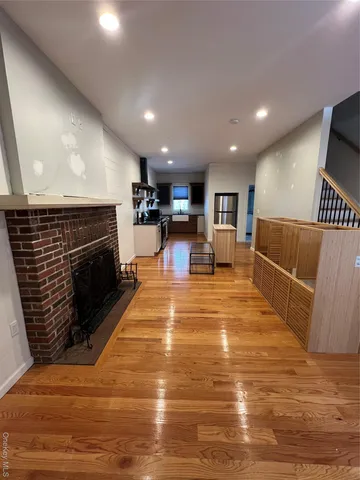 a view of kitchen with furniture and fireplace
