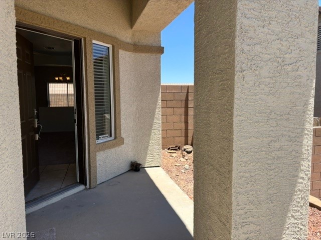 2866 Shimmering Bay Street Laughlin, NV 89029 - Photo 5 of 32 A welcoming covered porch with stucco columns frames the home's inviting entry.