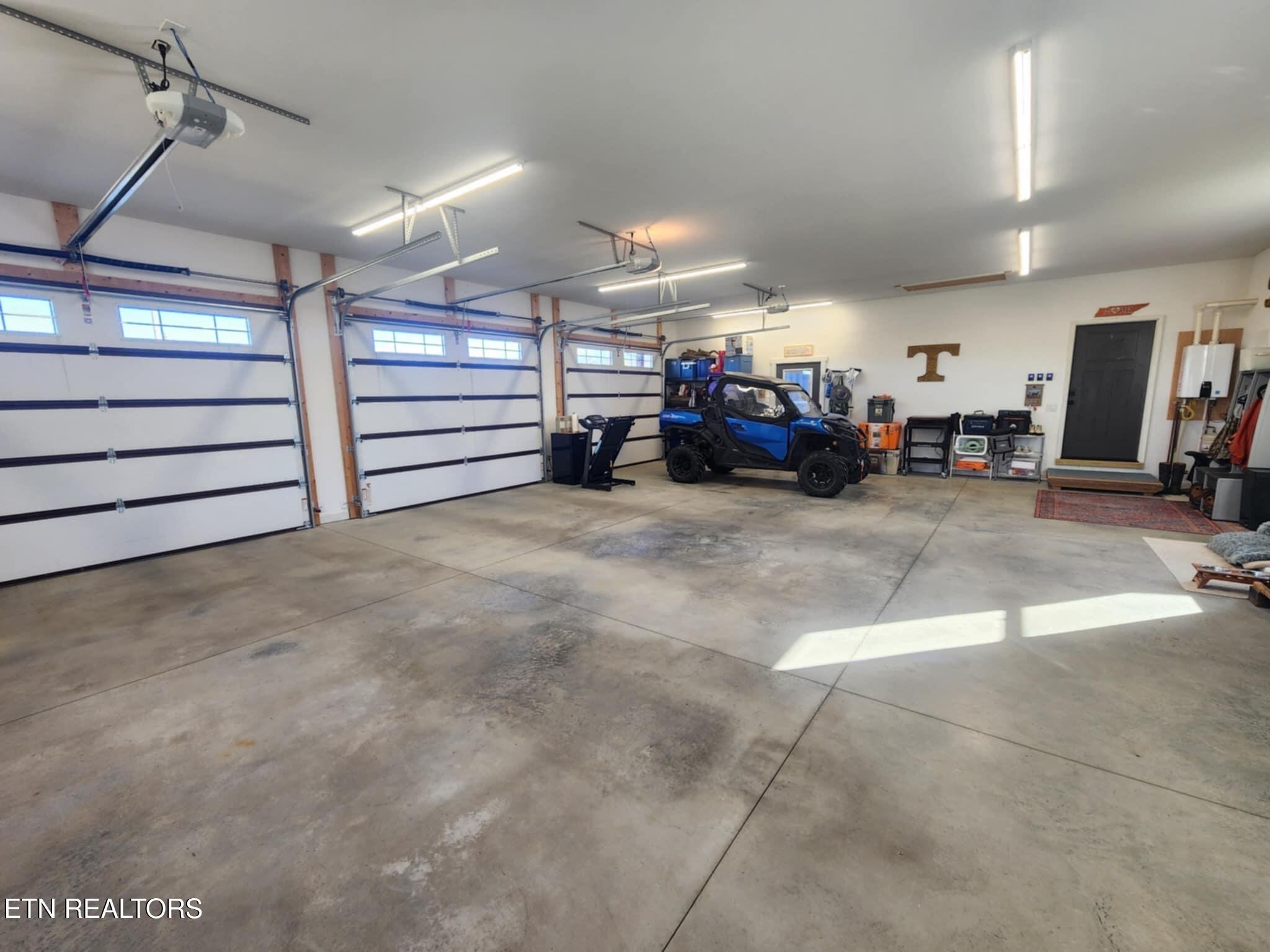 768 Winningham Road Crossville, TN 38572 - Photo 33 of 54 a view of a garage with parked cars