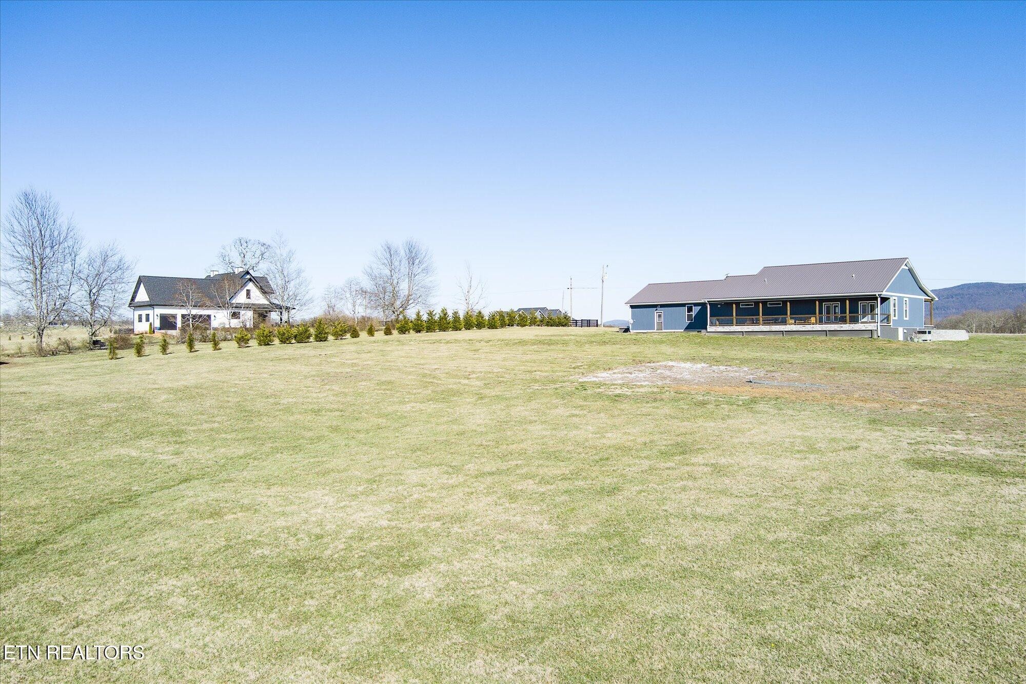 768 Winningham Road Crossville, TN 38572 - Photo 42 of 54 a view of a lake with houses in the background