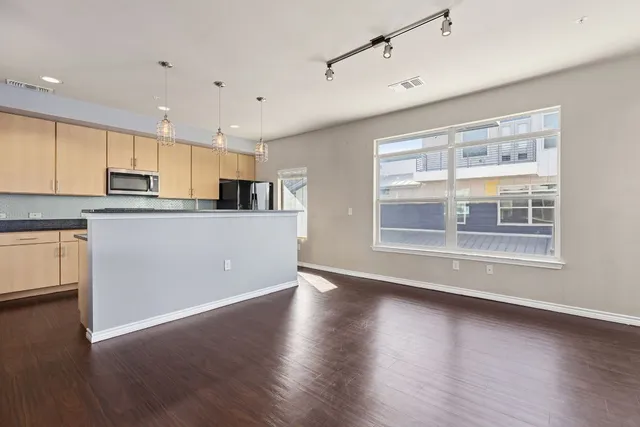a bathroom with a toilet sink and a mirror