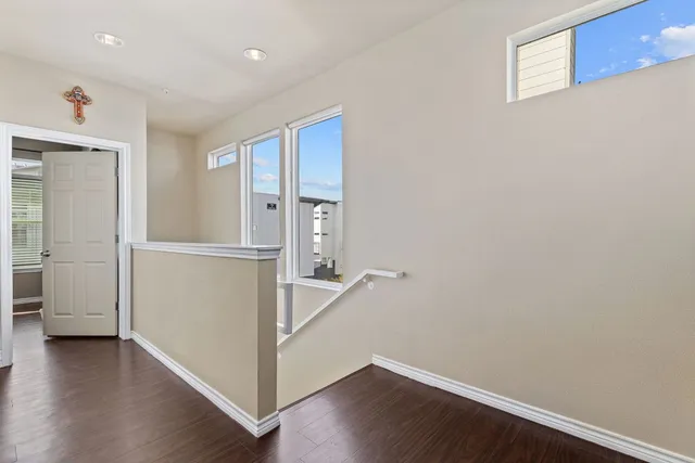 a room with furniture and wooden floor