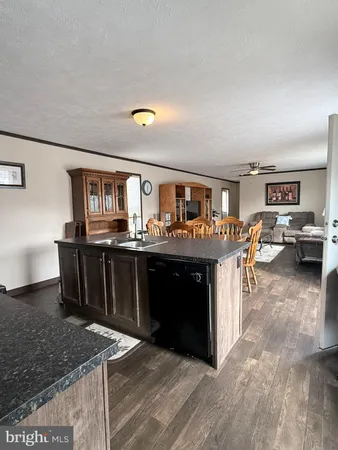 a kitchen with stainless steel appliances granite countertop a stove and a refrigerator