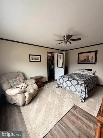 a bedroom with bed and window