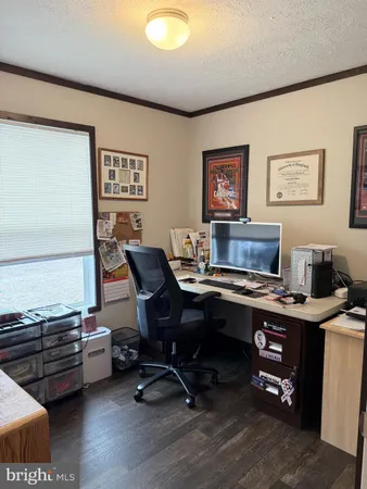 a workspace with furniture and wooden floor