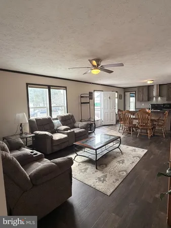 a living room with furniture and a table