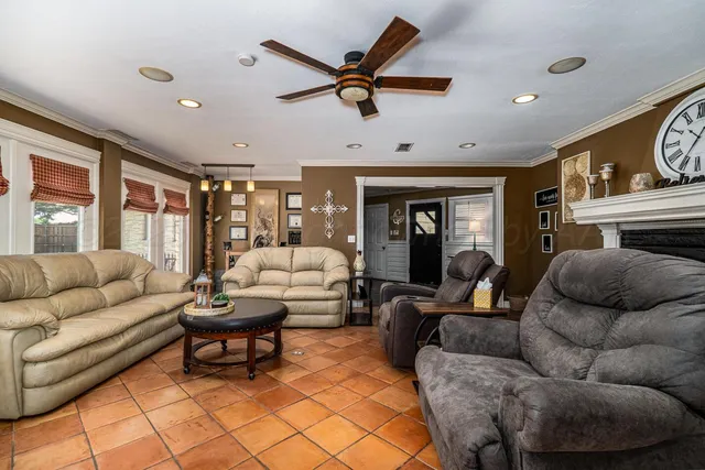 a living room with furniture and a fireplace