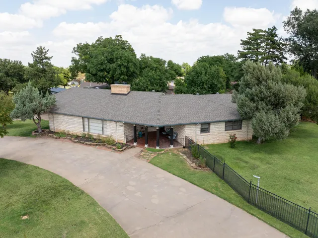a kitchen with stainless steel appliances a stove a microwave and a refrigerator