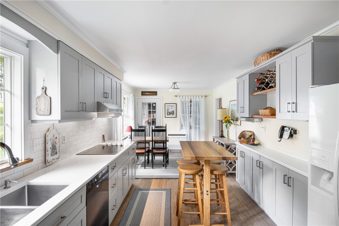 16 Circle Drive Middletown, RI 02842 - Photo 15 of 40 Eat-in kitchen accommodates a table for 6 at end of room
