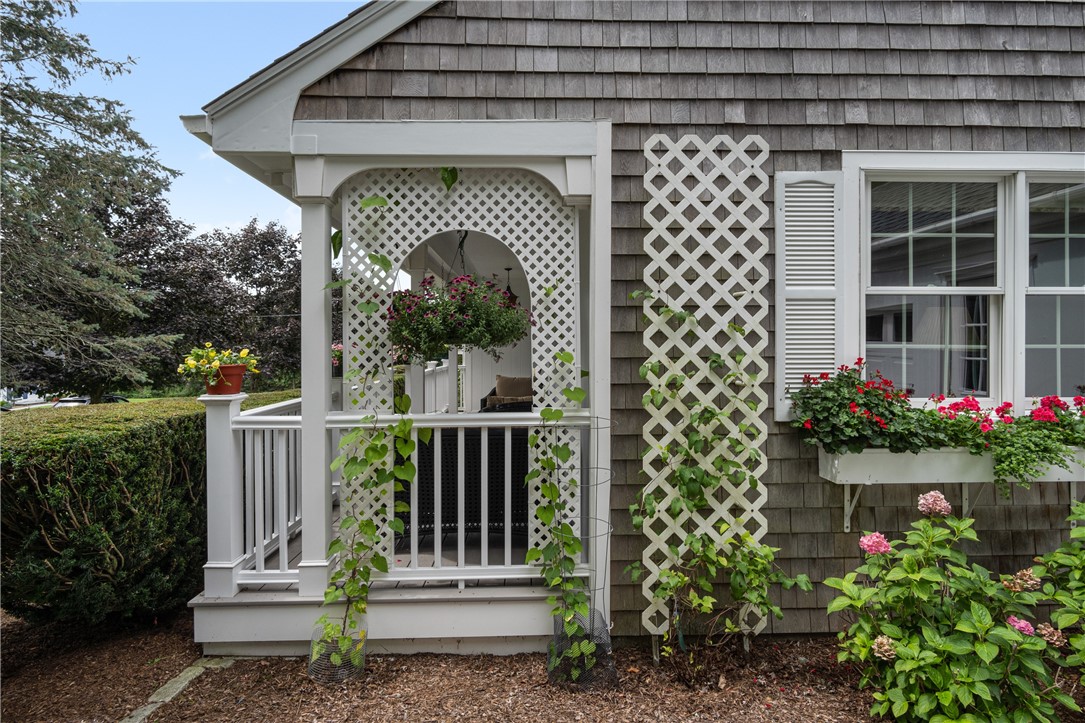 16 Circle Drive Middletown, RI 02842 - Photo 9 of 40 Lattice work for climbers at end of front porch