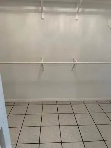 a bathroom with a shower and sink