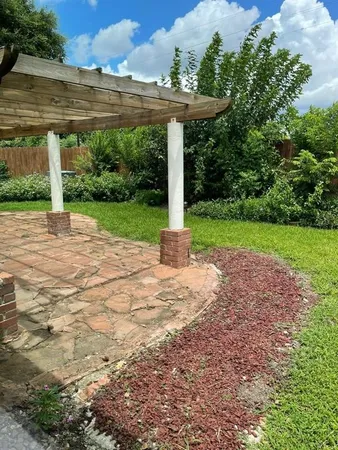 a view of a patio with a yard