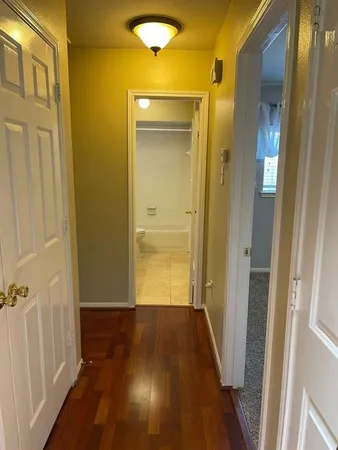 a view of an empty room with a window