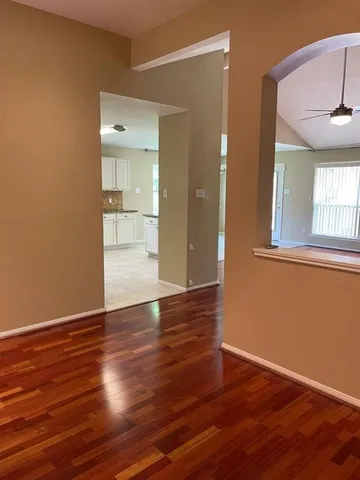 a kitchen with granite countertop a stove top oven microwave and cabinets