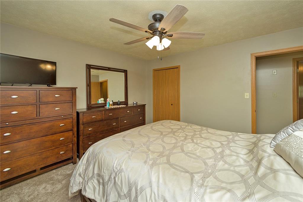 7326 Ringertown Road Export, PA 15632 - Photo 20 of 25 a bedroom with a bed and a flat screen tv