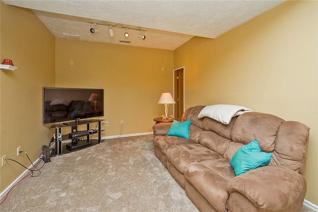 7326 Ringertown Road Export, PA 15632 - Photo 24 of 25 a living room with furniture and a flat screen tv