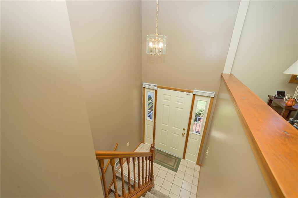 7326 Ringertown Road Export, PA 15632 - Photo 8 of 25 a view of a hallway with wooden floor and stairs