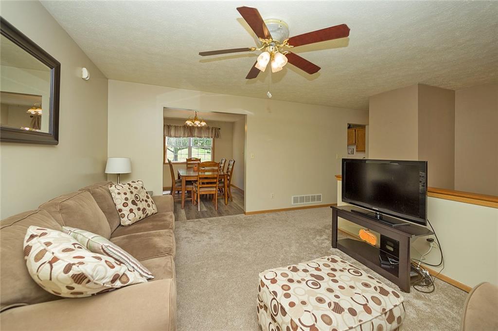 7326 Ringertown Road Export, PA 15632 - Photo 10 of 25 a living room with furniture and a flat screen tv