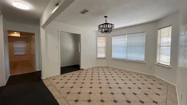 a view of a hallway with windows