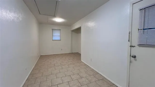 a view of hallway with a window