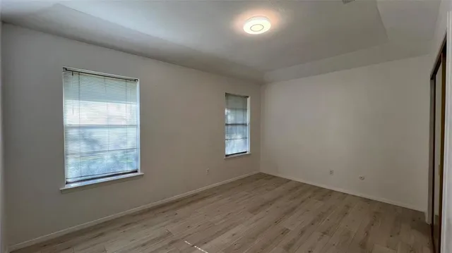 a bathroom with a shower and toilet