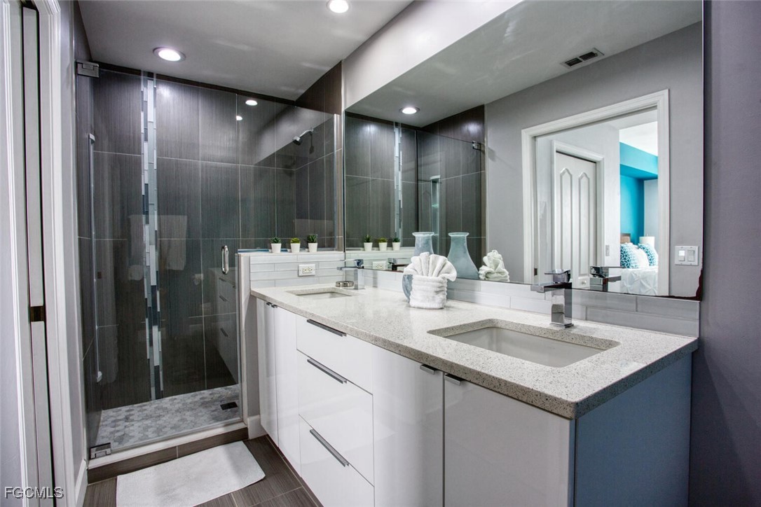 10371 Butterfly Palm Drive, Unit 834 Fort Myers, FL 33966 - Photo 13 of 22 a bathroom with a sink and a mirror
