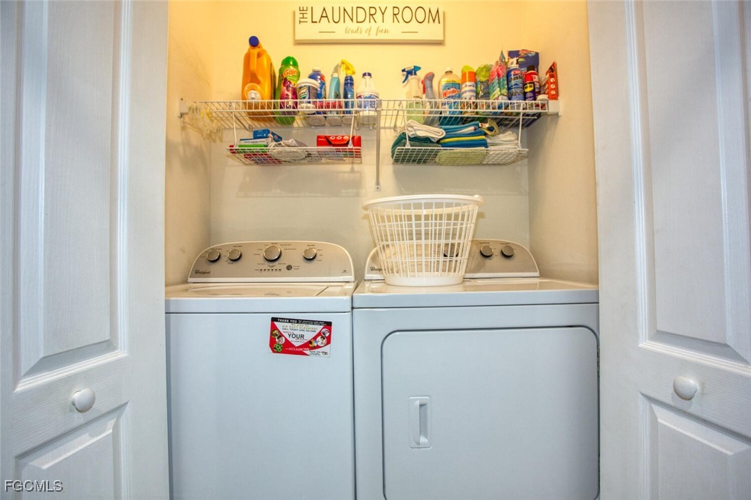 10371 Butterfly Palm Drive, Unit 834 Fort Myers, FL 33966 - Photo 18 of 22 a utility room with washer and dryer
