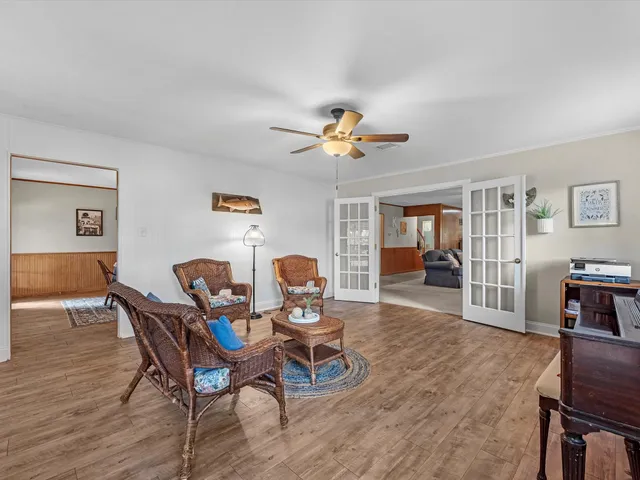 a dining room with furniture and window