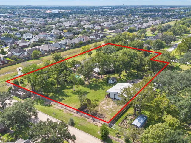 an aerial view of swimming pool and outdoor space