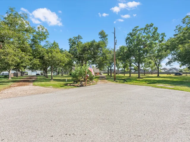 a view of a swimming pool with an outdoor space and seating area