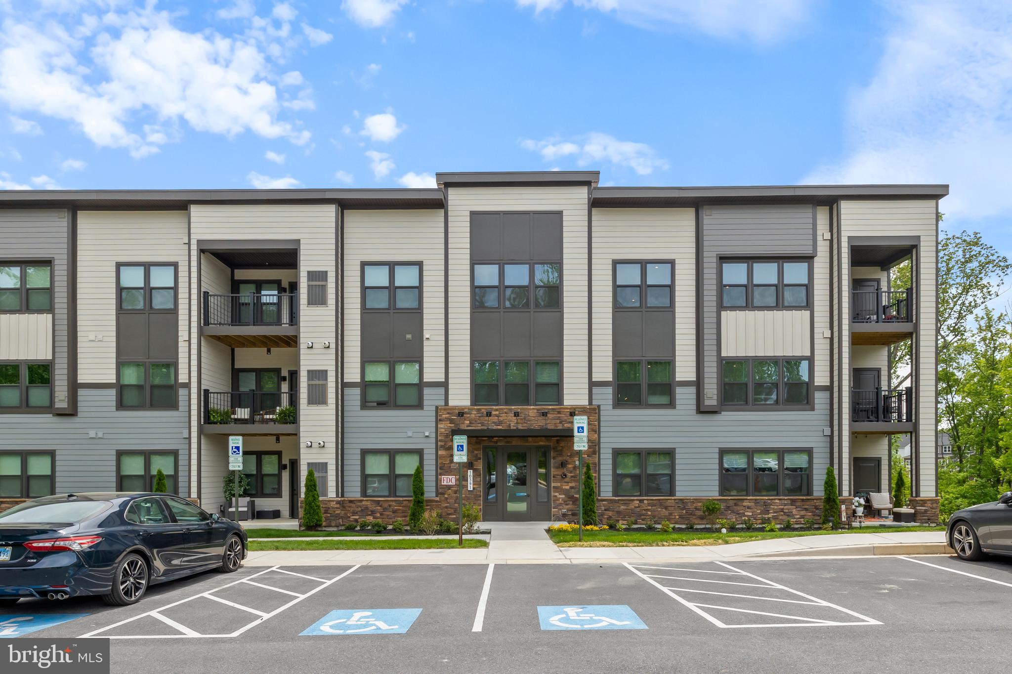 10391 Resort Road, Unit Q Ellicott City, MD 21042 - Photo 1 of 24 a front view of a building with street view