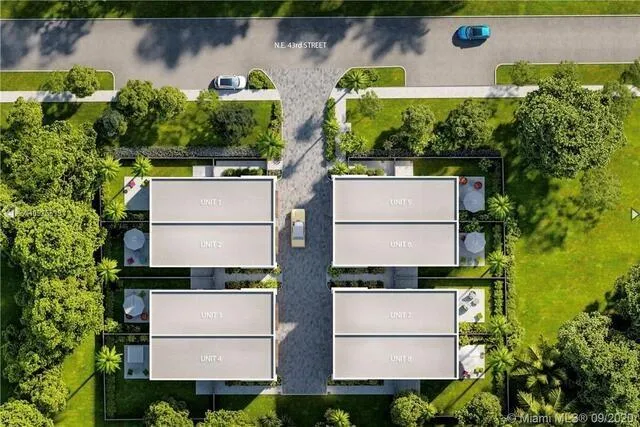 an aerial view of house with yard swimming pool and outdoor seating