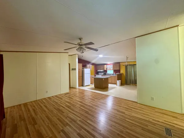 a view of a kitchen with a dishwasher and a refrigerator