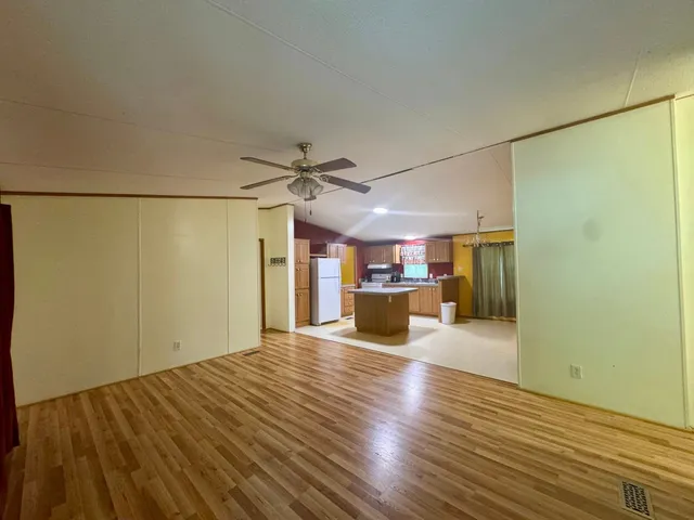 a view of a kitchen with a dishwasher and a refrigerator
