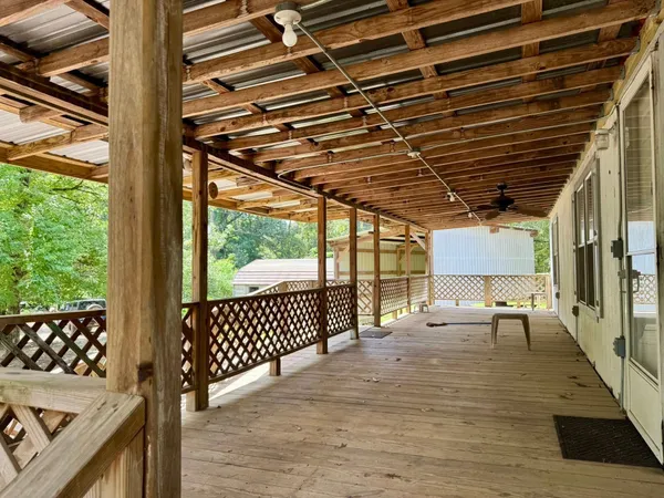 a outdoor space with patio lots of furniture and white walls