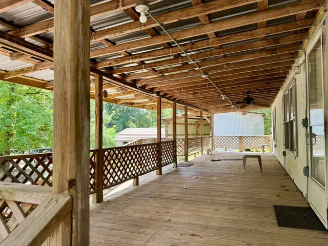 a outdoor space with patio lots of furniture and white walls
