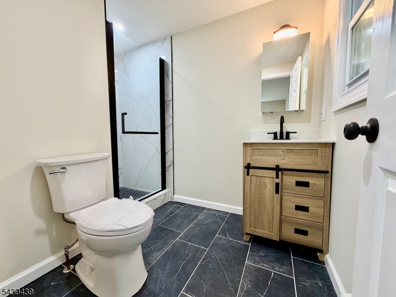 1 Appleseed Road Sussex, NJ 07461 - Photo 11 of 19 a bathroom with a toilet sink and mirror