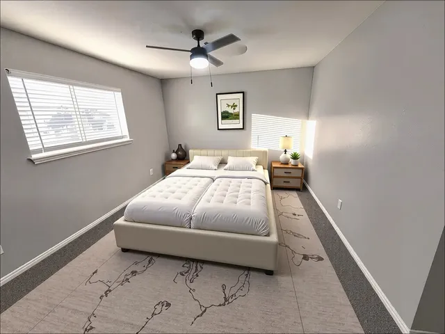 a bedroom with a bed and window