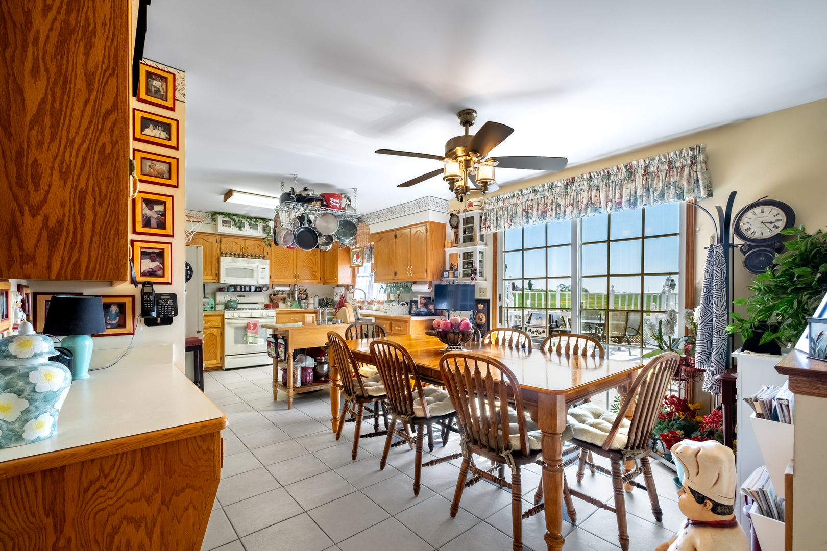 308 Calla Drive Manhattan, IL 60442 - Photo 13 of 30 a view of a dining room and livingroom with furniture wooden floor a rug and a chandelier