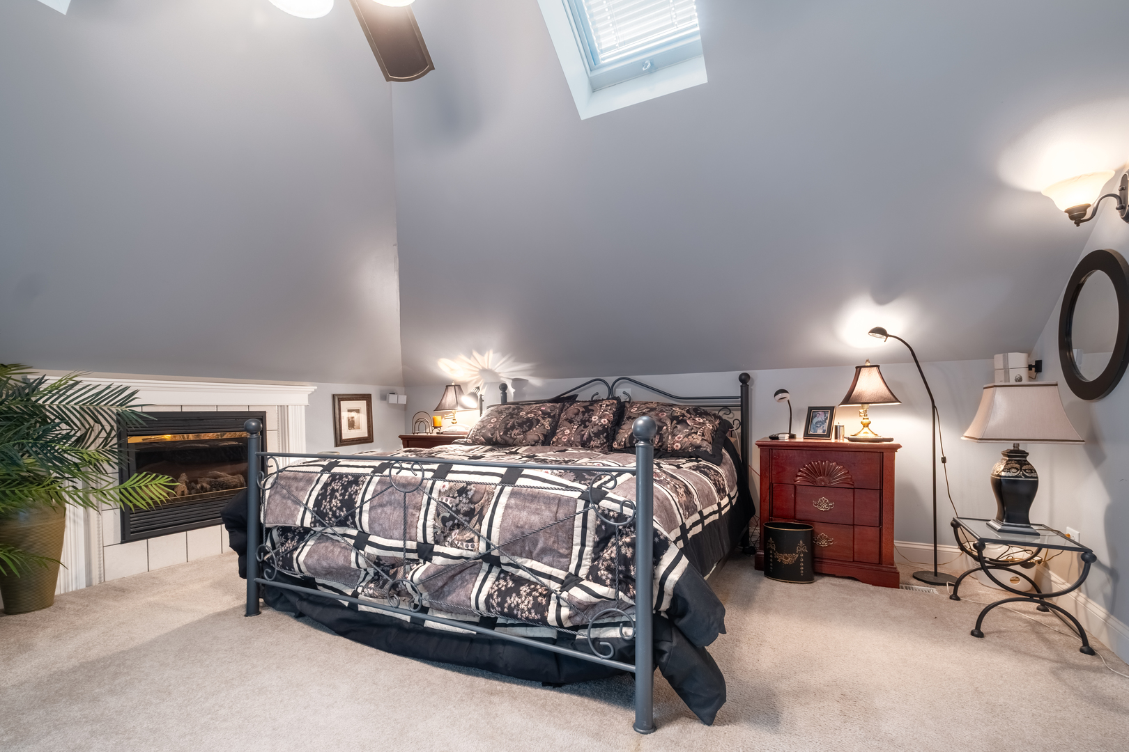 308 Calla Drive Manhattan, IL 60442 - Photo 17 of 30 a bedroom with a bed chair and fireplace