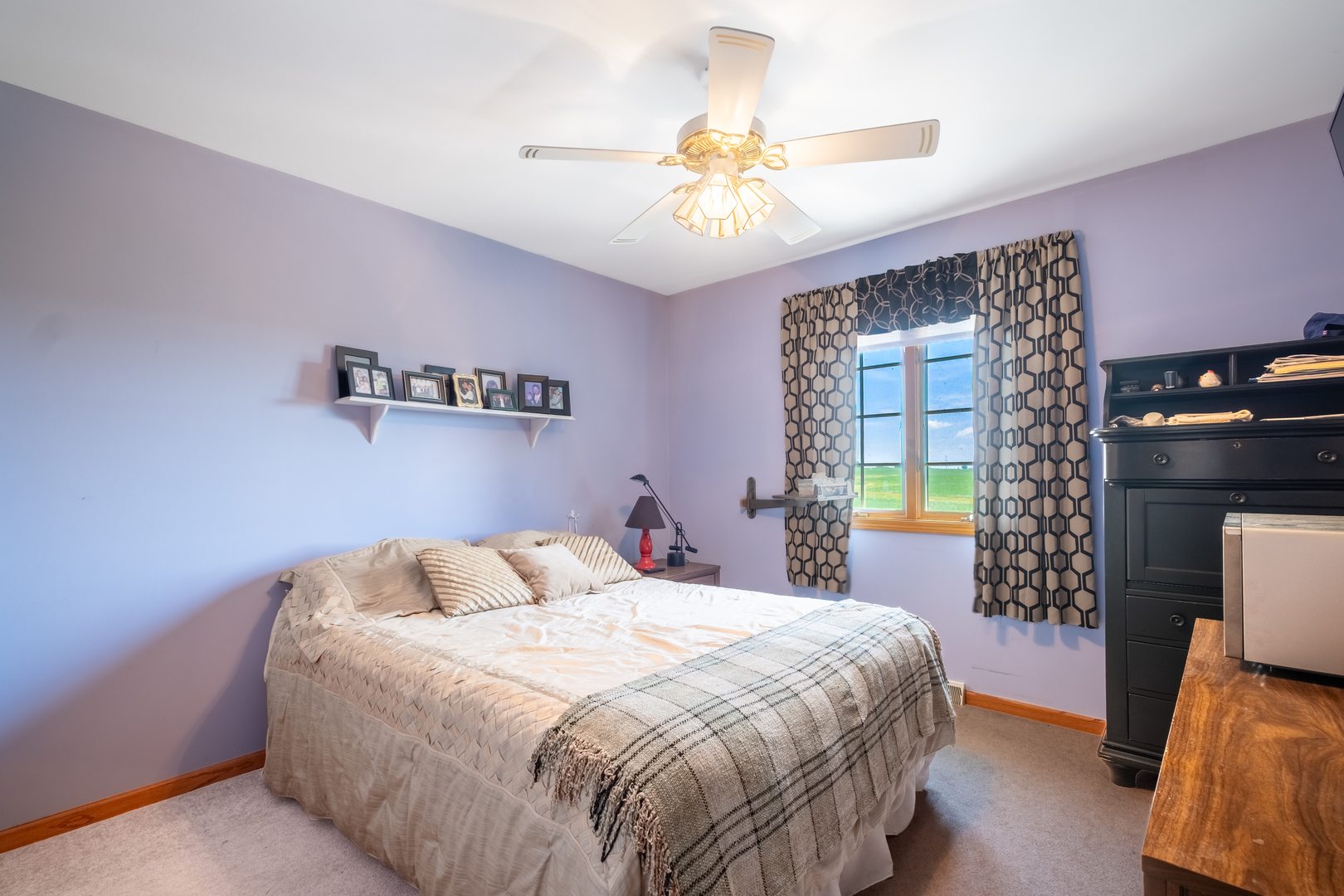 308 Calla Drive Manhattan, IL 60442 - Photo 18 of 30 a bedroom with a bed and a chandelier